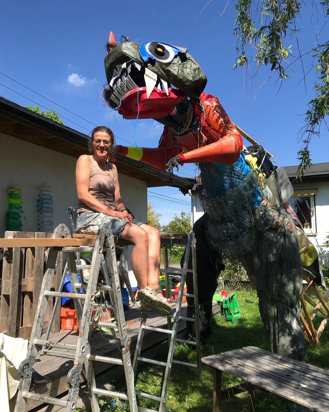 Artist Pippip Ferner working on her installation 'Plastozilla', a four meters tall dinosaur made entirely of plastic waste. Photo: Pippip Ferner
